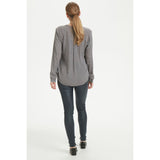 Marine blå coatede jeggings med elastik set bagfra på kaffe model