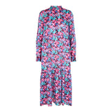 Meget smuk mønstret kjole med overskæringer og knapper ned fortil den har lange ærmer farverne er pink lilla og blå nuancer set forfra