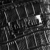 Sort taske med croco i sort skind med hank og aftagelige rem set på logo
