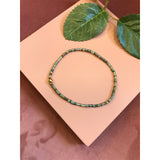 Friihof+Siig Flerfarvet (grøn) elastikarmbånd med guld perle