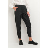 Mørkegrå trekvart bukser med elastik i livet bæltestropper og lommer i siden set fra siden