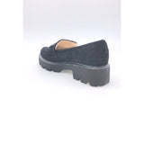 sorte chunky loafers med spænde og tykke såler og runde snuder set bagfra